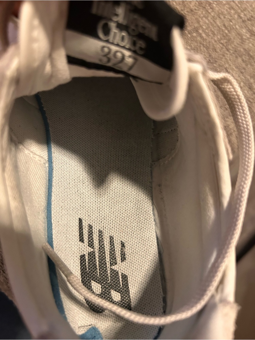 New Balance White and Black Low-Top Sneakers - Picture 6 of 9